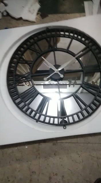 Round metal clock panel with mirror